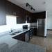 Granite countertops and stainless steel appliances are in every kitchen in the new Landmark student housing building. Melanie Maxwell I AnnArbor.com